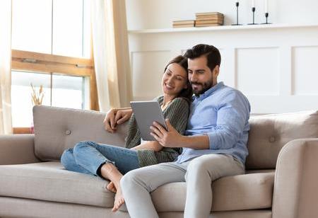 iStock couple homeowner sofa.jpg